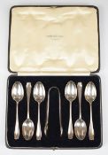 George V cased set of six hallmarked silver teaspoons and sugar tongs, London 1932, maker Josiah
