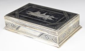 Thai silver cigarette box with niello decoration of a traditional building to the lid, marked to
