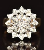 A 9ct gold ring set with diamonds in a cluster, 3.8g, size J