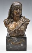 Bronze bust of a semi-clad lady wearing a headdress, on marble base with floral swag, height 35cm
