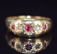 An 18ct gold ring set with rubies and diamonds in star settings, Chester 1918, 4.9g, size V