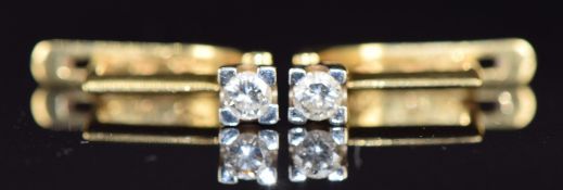 A pair of 18ct gold earrings each set with a diamond of approximately 0.15ct, 4.3g