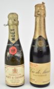 Two small bottles of Champagne comprising Duc de Marne 1928 vintage and Moët & Chandon, both