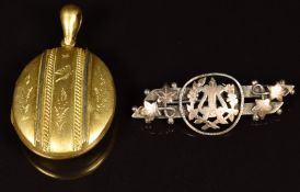 Victorian gilt locket and an Edwardian silver brooch