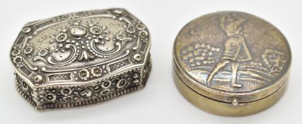Two silver pill or similar pots, one with lady golfer to lid stamped 925 the other with floral