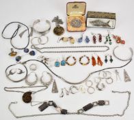 A collection of silver jewellery to include a filigree articulated fish, Victorian/ Edwardian brooch