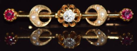 An 18ct gold brooch set with an old cut diamond measuring approximately 0.25ct, seed pearls in