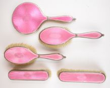 Art Deco hallmarked silver and pink guilloché enamel dressing table set comprising mirror and four
