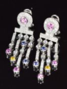 A pair of 14k white gold earrings set with pink sapphires, tanzanites and cubic zirconia, 13.8g