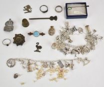 A collection of jewellery including silver brooch, silver ARP brooch, two silver rings, two silver