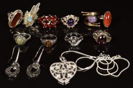 Ten silver rings set with garnets, pressed amber, agate, amethyst, Connemara marble and marcasite