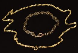 A 9ct gold necklace made up of twisted interlocking links and a 9ct gold bracelet made up of pierced