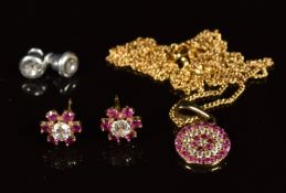A 9ct gold ruby and cubic zirconia pendant on 9ct gold chain and a pair of 9ct gold earrings set
