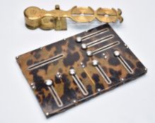 Taylor rocker type sovereign coin balance or scales and a tortoiseshell or similar bridge marker