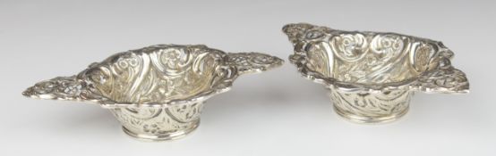 Pair of Victorian hallmarked silver bon bon dishes with embossed and pierced decoration,