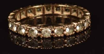 A 9ct gold eternity ring set with synthetic spinel, 2.1g