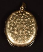 A 9ct gold locket with engraved floral decoration, length 5cm, 13.5g