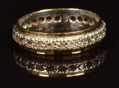 A 9ct gold eternity ring set with spinel, 2.6g