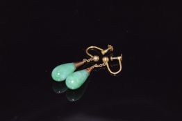 A pair of 9ct gold earrings set with jadeite, 4.8g
