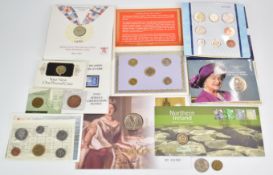 A quantity of Royal Mint etc coin and coin / stamp cover presentation packs etc