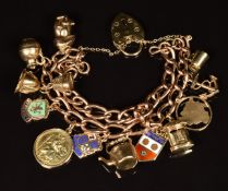 A 9ct gold charm bracelet with thirteen 9ct gold charms including rabbit, letterbox, St Christopher,