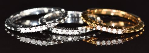 A 9k gold ring set with diamonds, and two matching white gold rings, 6.3g, size N