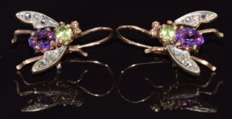 A pair of 9ct gold earrings in the form of insects, set with an oval cut amethyst, round cut peridot