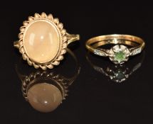 An 18ct gold ring set with an emerald and rose cut diamonds in platinum setting (1.8g, size M) and a