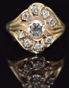 A 14k gold ring set with nine diamonds, the centre diamond approximately 0.7ct, 5.4g, size P