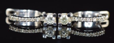 A pair of 18k white gold earrings set with diamonds, the largest diamond approximately 0.13ct, 3.