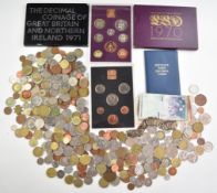 A quantity of overseas coinage together with some UK Royal Mint coin packs, Asian white metal coin