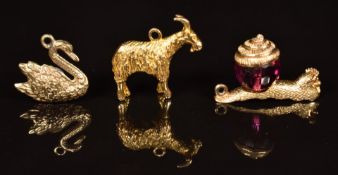 Three 9ct gold charms / pendants in the form of a goat, swan and snail, 9.8g