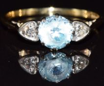 An 18ct gold ring set with topaz and diamonds, 2.6g, size N