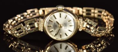 Rotary 9ct gold ladies wristwatch with two-tone hands and hour markers, silver dial and signed 17