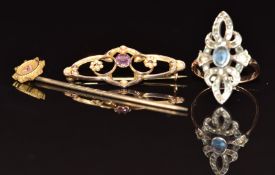 A 9ct gold stick pin set with a ruby, 9ct gold brooch (1.2g) and 9ct gold and silver ring