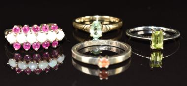 A 9ct gold ring set with a topaz (2.1g, size N) and three silver rings