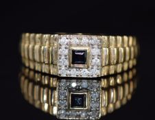 A 9ct gold ring set with a square sapphire and diamonds, with textured shoulders, 5.8g, size W