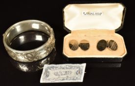 A silver bangle, silver cufflinks and brooch made from a the Potters Bar Zeppelin LZ72 (L31) with