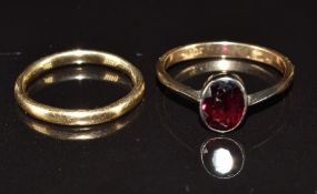 Two 9ct gold rings, one set with an oval cut garnet, 3.7g, size H & M
