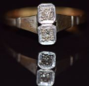 An 18ct gold ring set with two diamonds in a platinum setting, 2.3g, size P