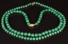 Two malachite beaded necklaces, one with 9ct gold clasp, the other 18ct