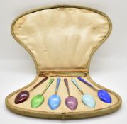 Cased set of hallmarked silver gilt and guilloché enamel spoons with import marks for London 1911,