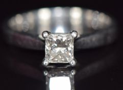 A platinum ring set with a princess cut diamond of 0.6ct, with GIA certificate, 4.7g, size K