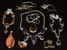 Nine silver necklaces/ pendants set with pressed amber, amethyts, agate, quartz and garnets