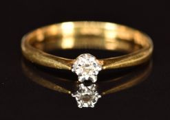 An 18ct gold ring set with a diamond in an illusion setting, 2g, size P/Q