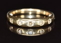 A 9ct gold ring set with five round cut champagne diamonds, 2.1g, size L
