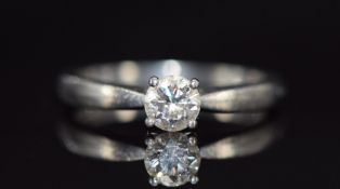 A platinum ring set with a 0.41ct round brilliant cut diamond, with GIA certificate stating VS2 / F