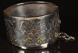 Aesthetic period silver bangle with applied gold floral decoration