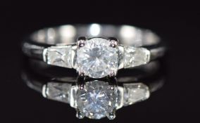 An 18k white gold ring set with three diamonds, total diamond weight approximately 0.5ct, 2.6g, size