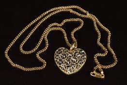 A 14k gold pendant in the form of a heart with pierced floral decoration, on a 9ct gold chain, 12g
